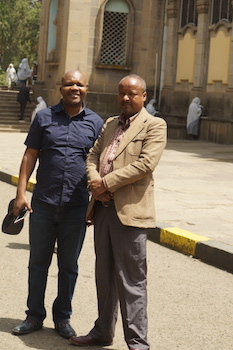 Moses Ochonu with one of the guides in front of the historic Holy Trinity Cathedral in Addis Ababa.