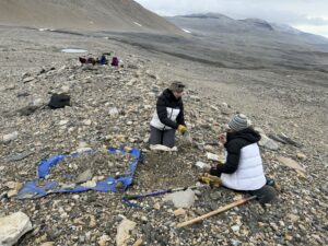 Collecting glacial till samples in the Royal Society Range in 2022.