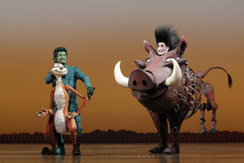 Timon and Pumba puppets and puppeteers. Photo by Joan Marcus.  
